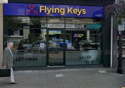 Flying Keys Lettings shopfront on Blackwood High Street with the purple and gold brand sign